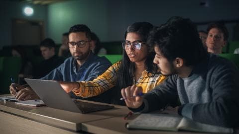 Students working on a project together in class