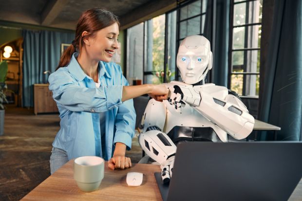 Woman and robot fist pumping