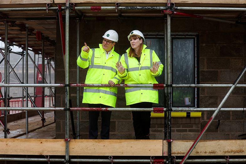 Britain’s prime minister Keir Starmer (L) and Britain’s deputy prime minister and levelling up, housing and communities secretary Angela Rayner speak together as they visit a construction site in Cambridgeshire, east England, on 12 December 2024. Britain’s prime minister Keir Starmer (L) and Britain’s deputy prime minister and levelling up, housing and communities secretary Angela Rayner speak together as they visit a construction site in Cambridgeshire, east England, on 12 December 2024.